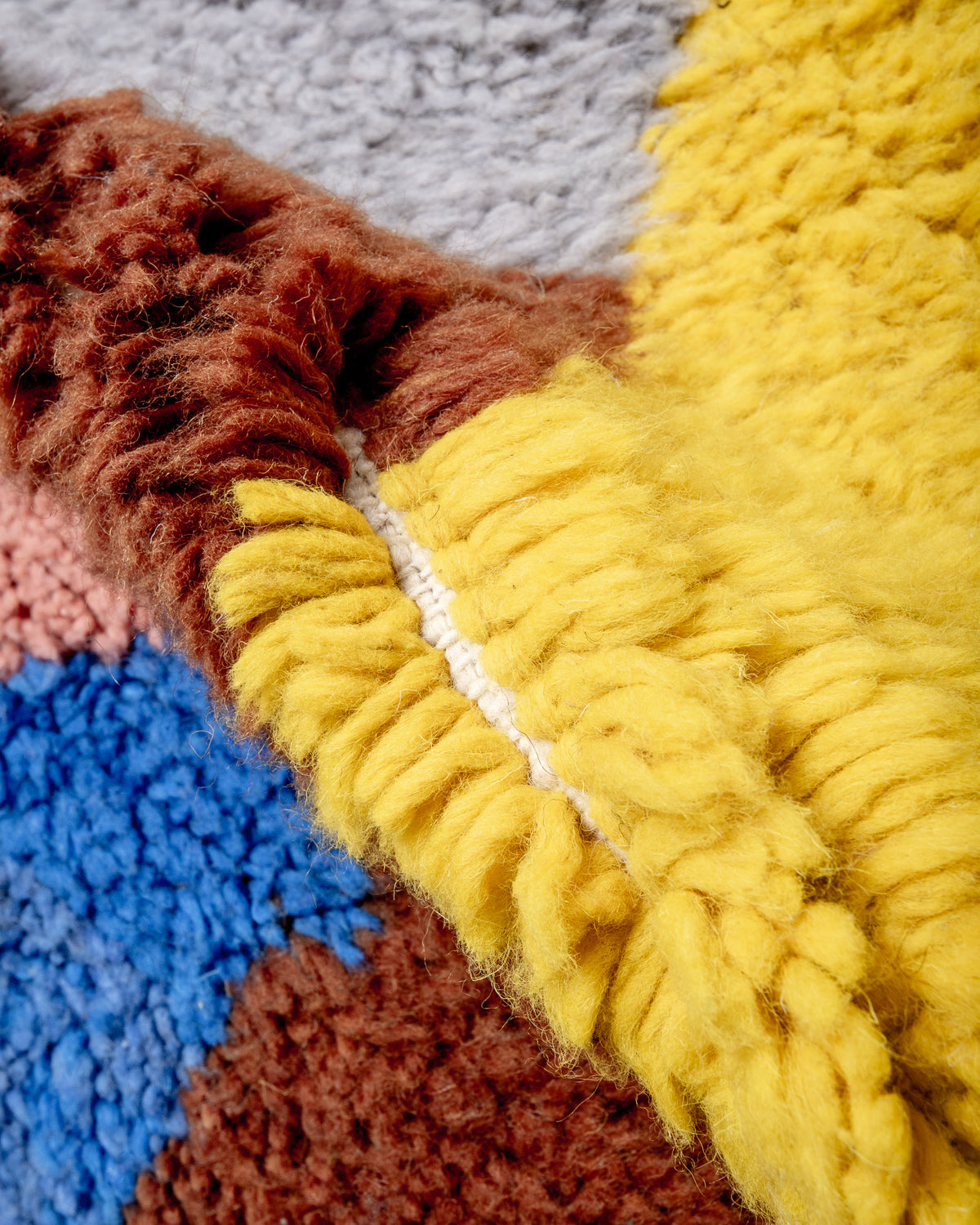 Modern, designer, handcrafted Berber rug from Morocco. Beniourain carpet with beautiful colours and patterns and fluffy wool texture.